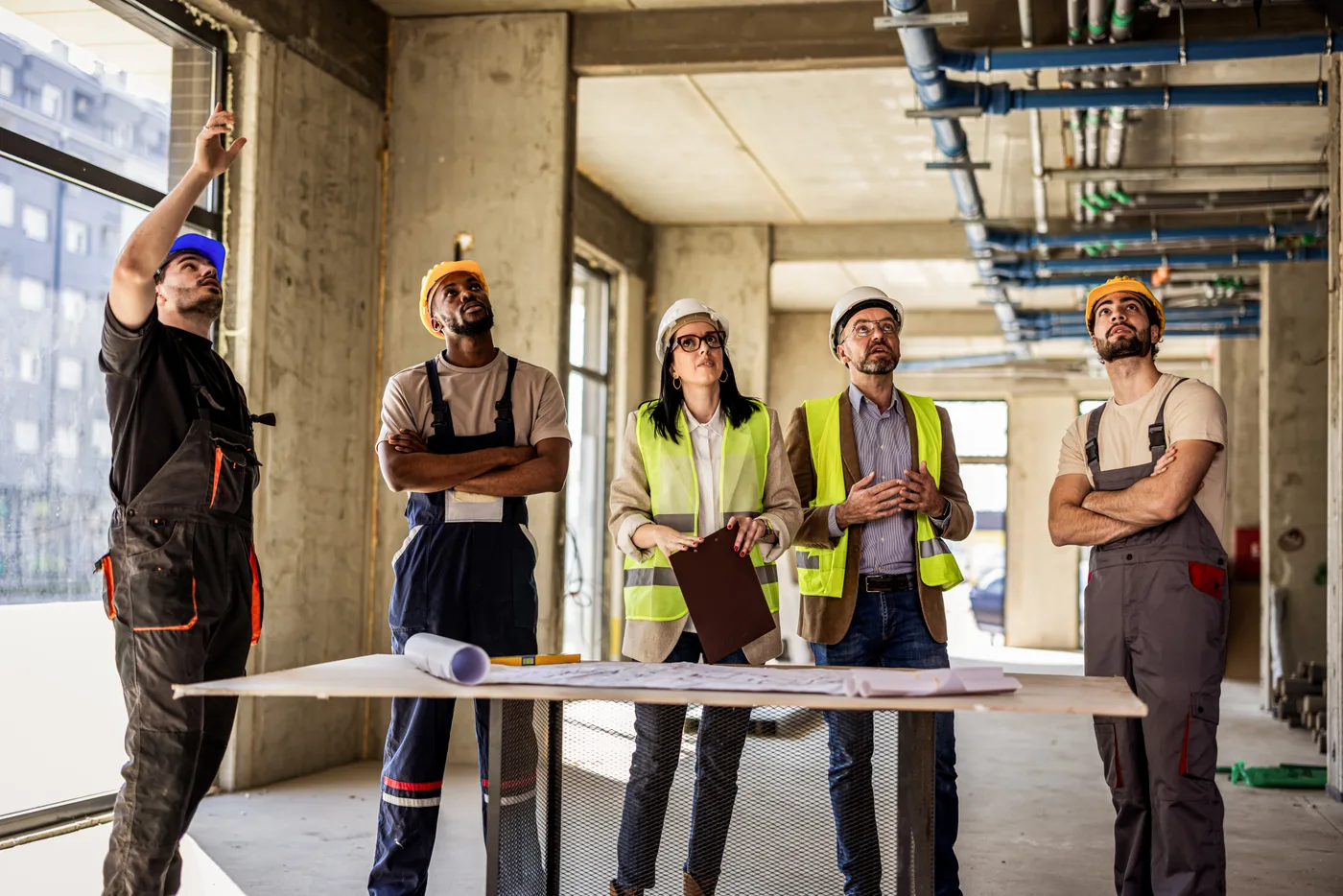 Construction and engineering team overseeing a commercial building site visit